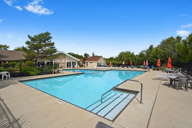 a view of swimming pool with chairs