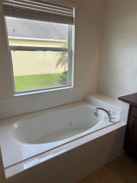 2862 Running Brook Circle Kissimmee, FL 34744 - Photo 13 of 24 a bathroom with a bathtub