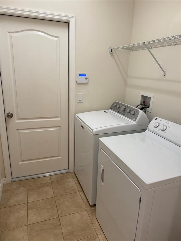 2862 Running Brook Circle Kissimmee, FL 34744 - Photo 16 of 24 a utility room with dryer and washer