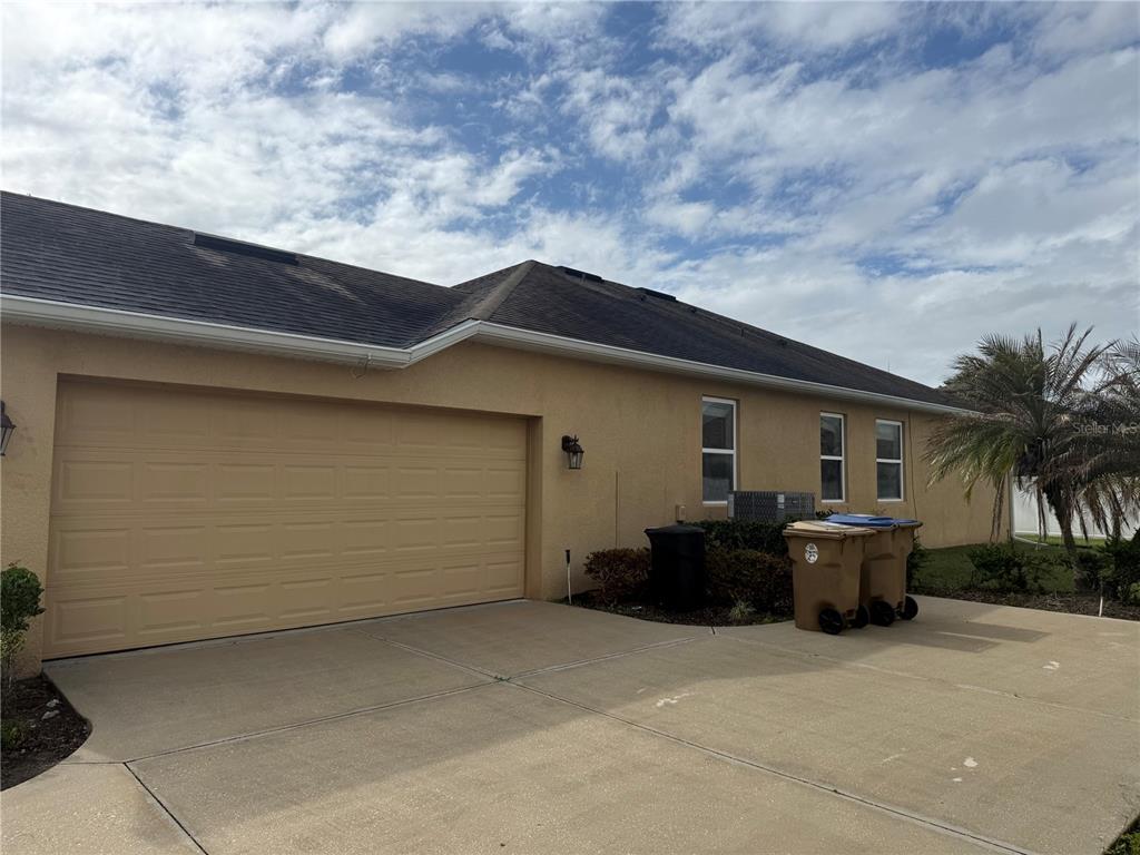 2862 Running Brook Circle Kissimmee, FL 34744 - Photo 4 of 24 a backyard of a house with potted plants and barbeque oven
