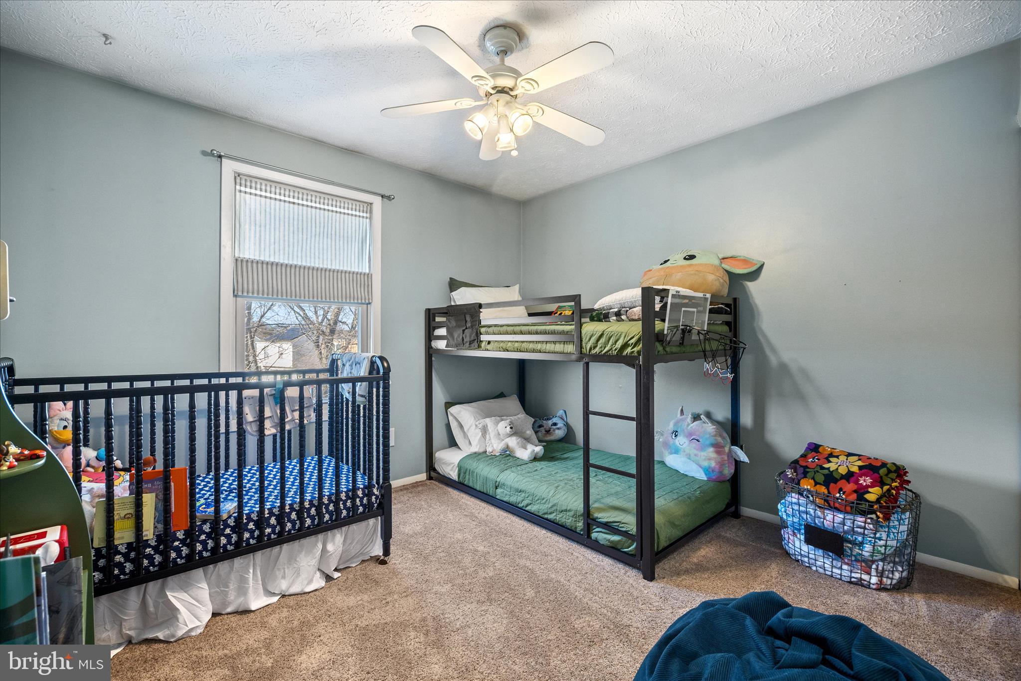 7914 Leeds Drive Pasadena, MD 21122 - Photo 20 of 49 a bedroom with bed and a chandelier