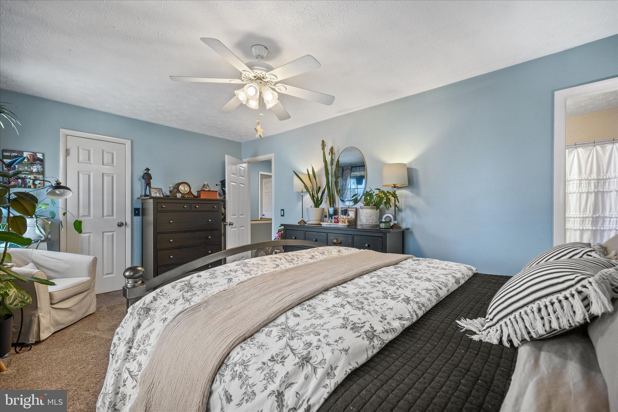 7914 Leeds Drive Pasadena, MD 21122 - Photo 26 of 49 a bedroom with bed and a chandelier