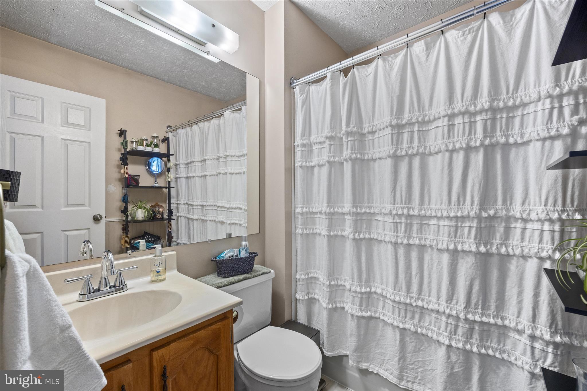 7914 Leeds Drive Pasadena, MD 21122 - Photo 27 of 49 a bathroom with a sink toilet and shower