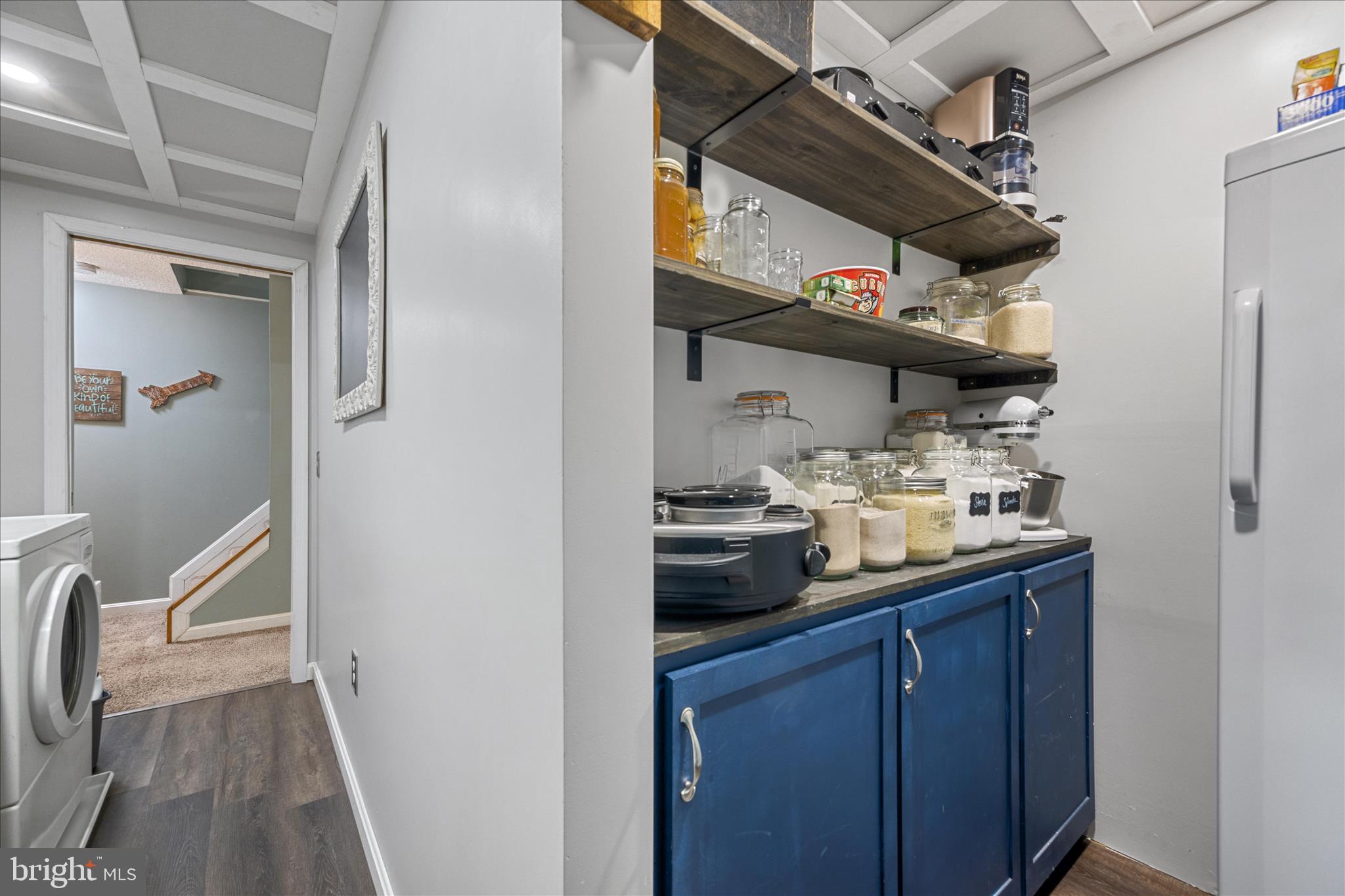 7914 Leeds Drive Pasadena, MD 21122 - Photo 29 of 49 a kitchen with stainless steel appliances granite countertop a sink and wooden cabinets