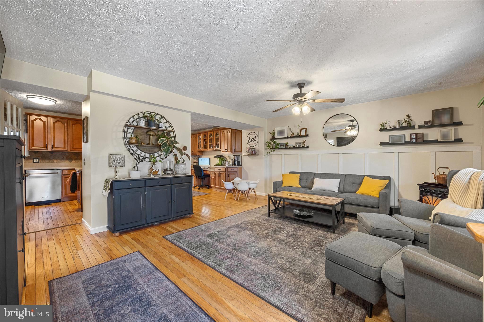 7914 Leeds Drive Pasadena, MD 21122 - Photo 3 of 49 a living room with furniture and a wooden floor