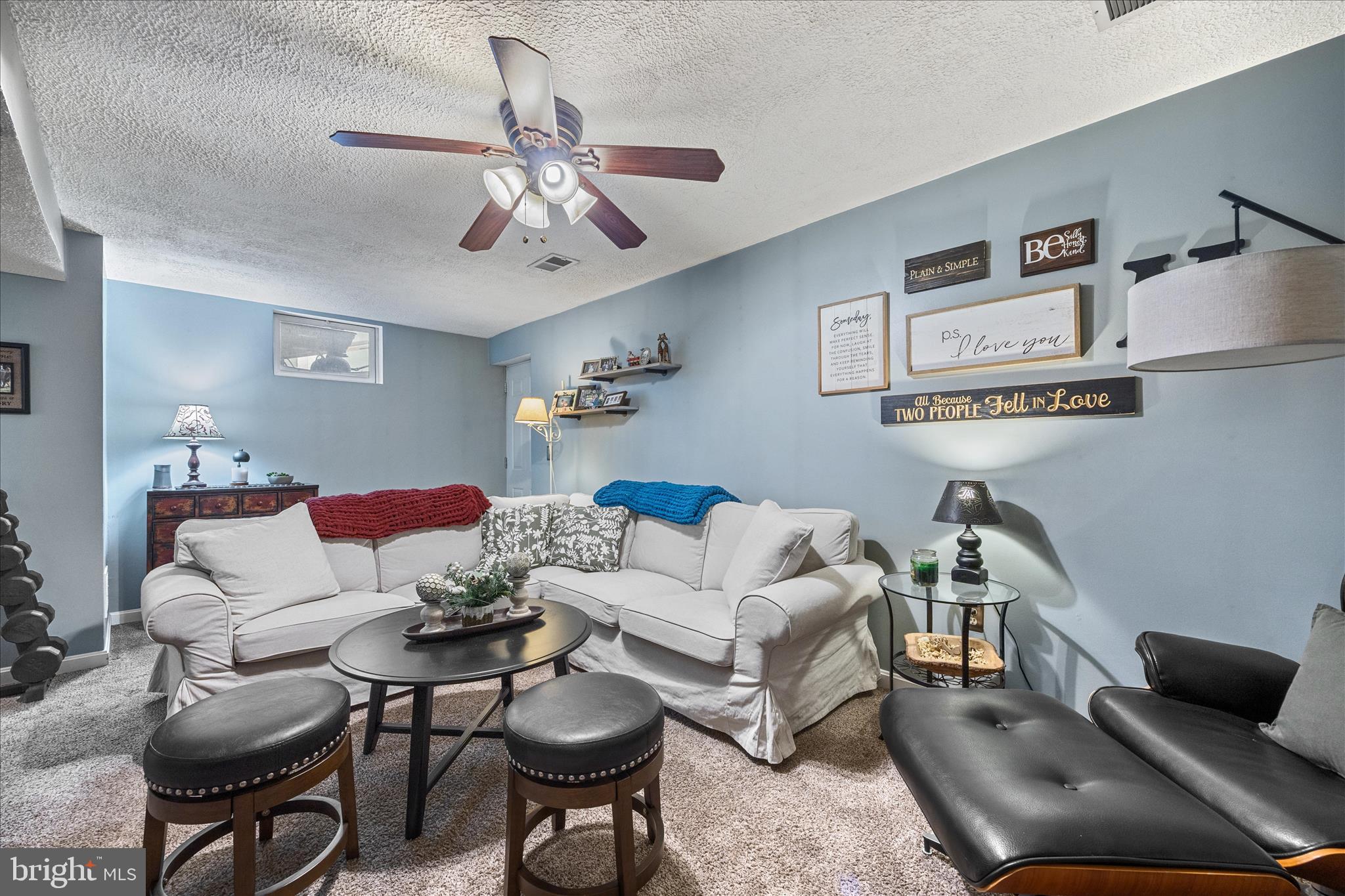 7914 Leeds Drive Pasadena, MD 21122 - Photo 35 of 49 a living room with furniture and a chandelier
