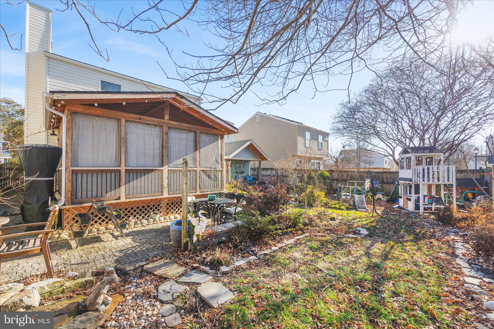 7914 Leeds Drive Pasadena, MD 21122 - Photo 42 of 49 a backyard of a house with table and chairs