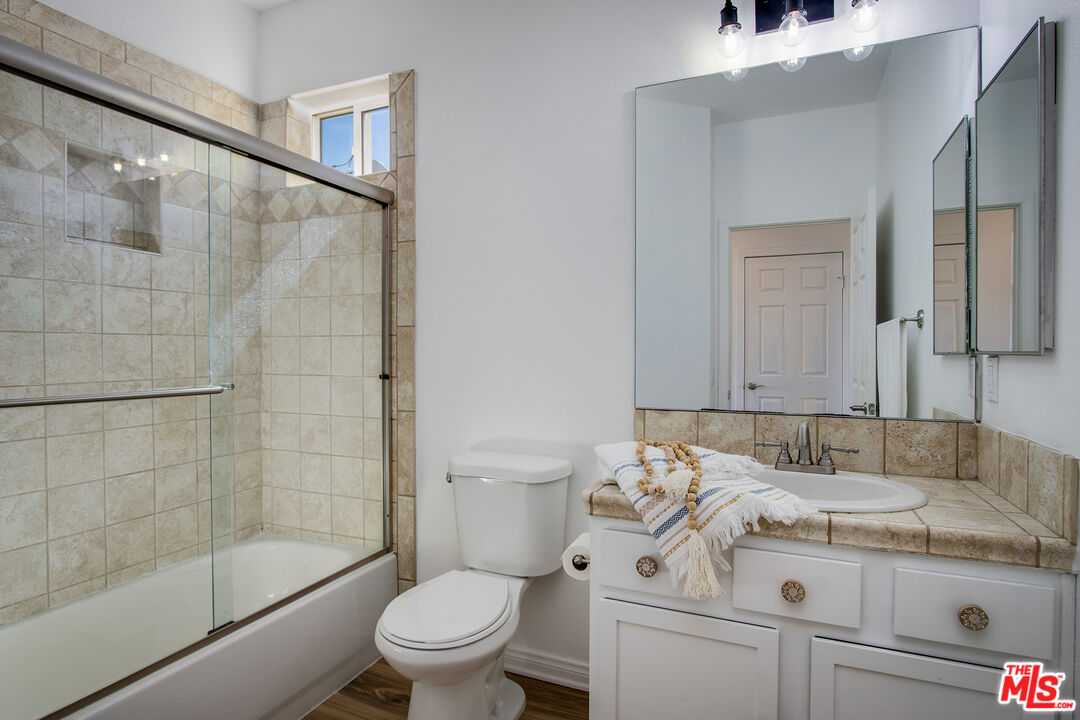 7285 Agave Road Joshua Tree, CA 92252 - Photo 14 of 18 a bathroom with a sink a toilet and shower