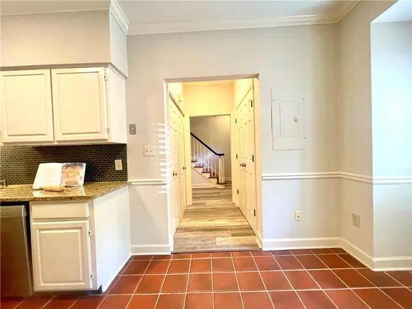 a view of a chandelier and wooden floor