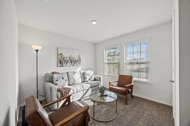 a spacious bathroom with a double vanity sink and mirror