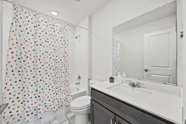 a bedroom with two beds and a window