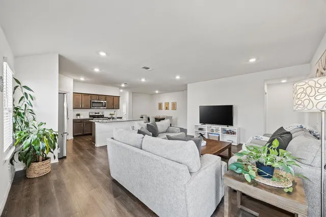 a house view with swimming pool in front of it