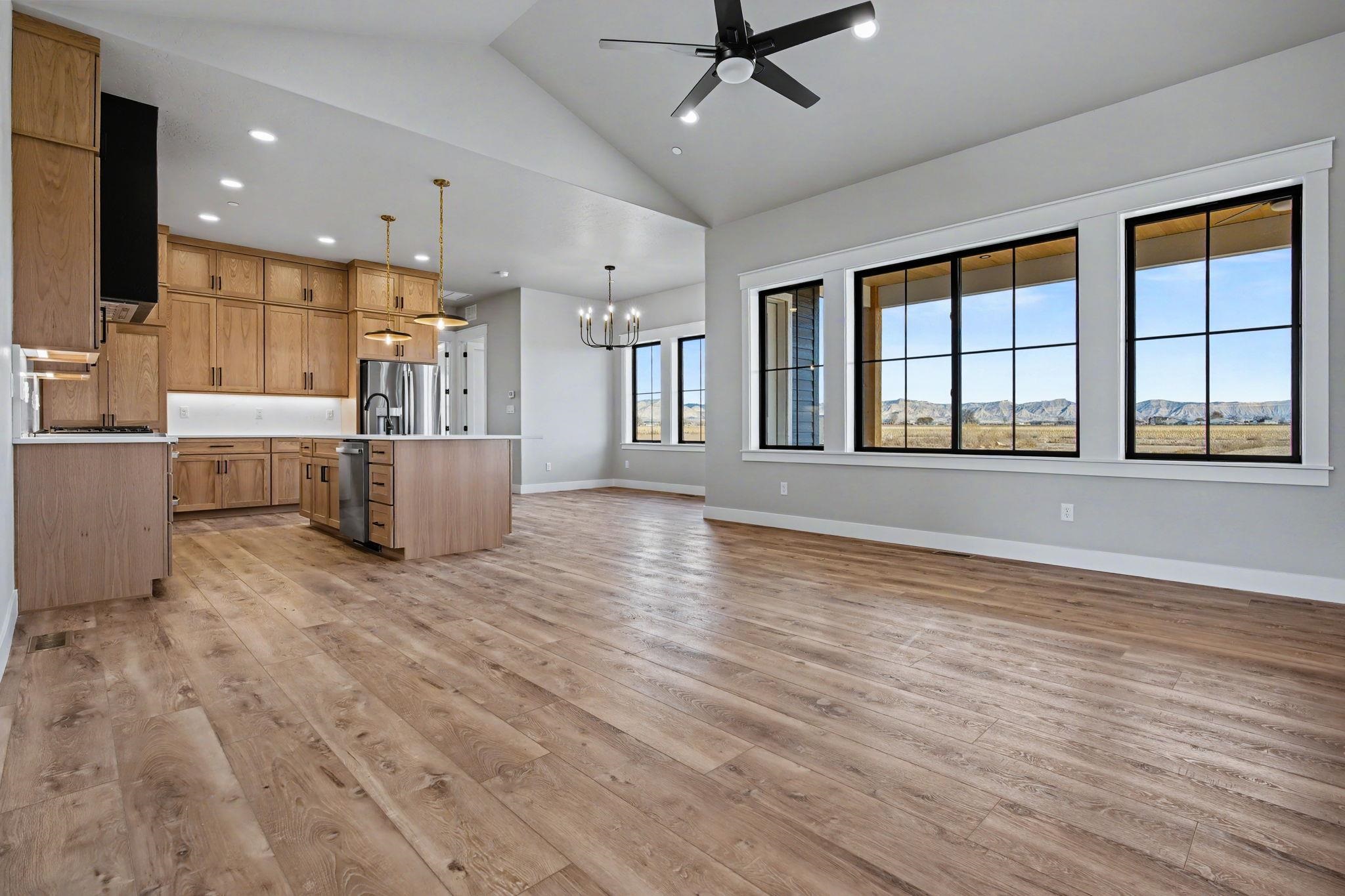 1924 K Road Fruita, CO 81521 - Photo 12 of 40 a view of an empty room with wooden floor and a window