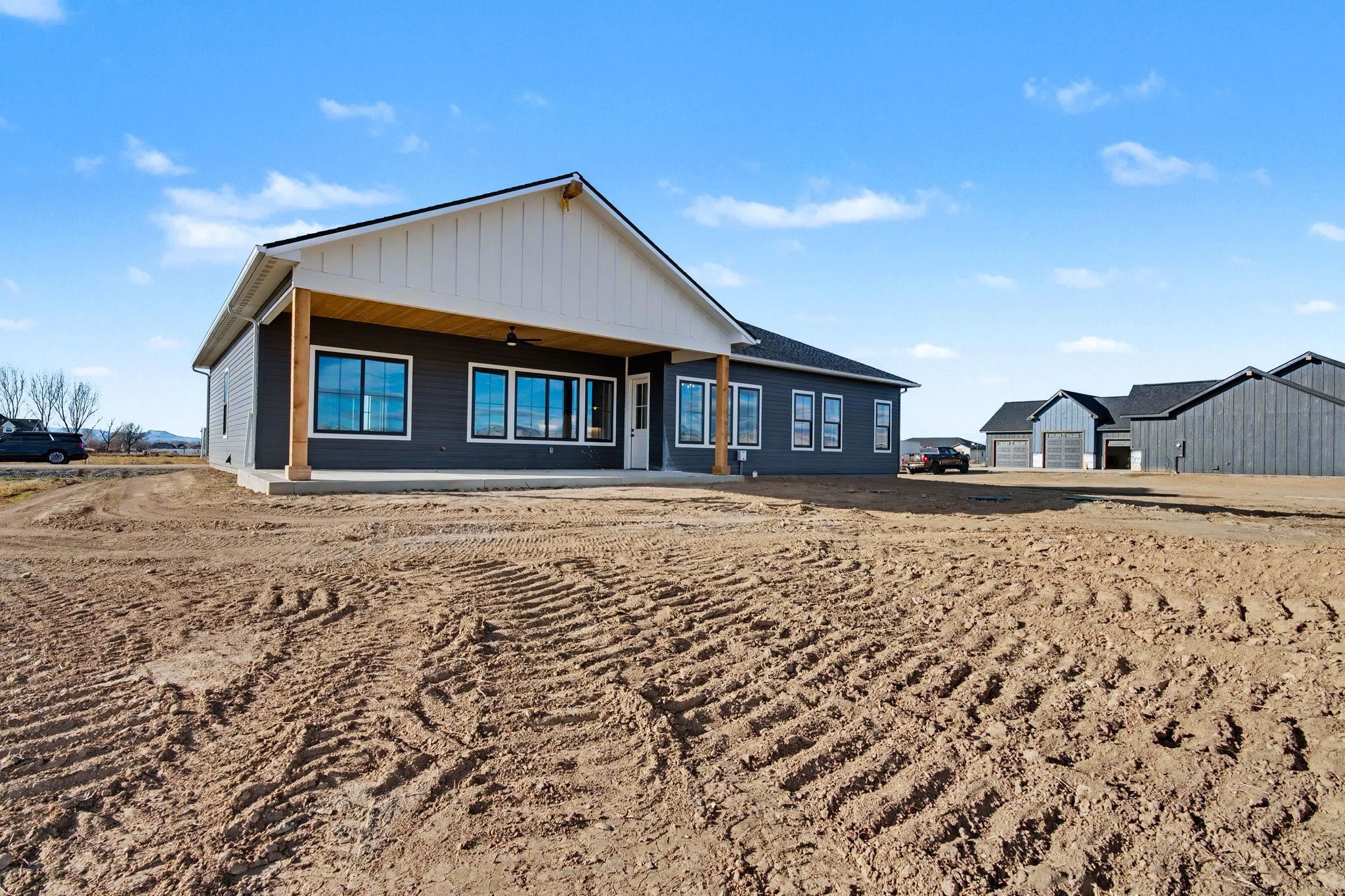 1924 K Road Fruita, CO 81521 - Photo 16 of 40 a front view of a house with a yard