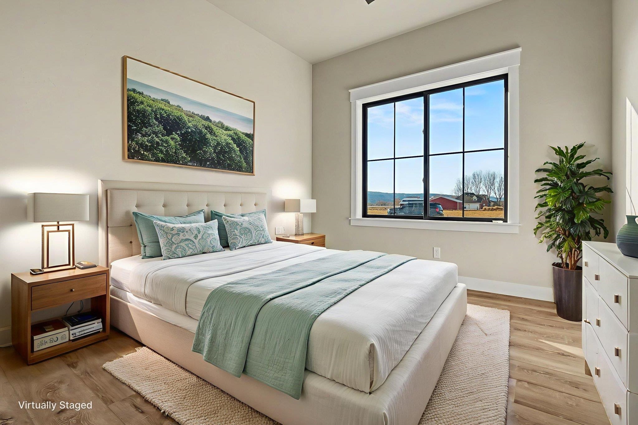 1924 K Road Fruita, CO 81521 - Photo 22 of 40 a bedroom with a bed and a large window with outer view