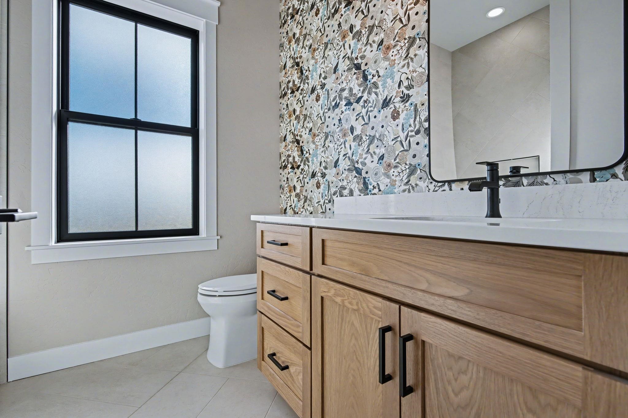 1924 K Road Fruita, CO 81521 - Photo 24 of 40 a bathroom with a sink toilet and mirror