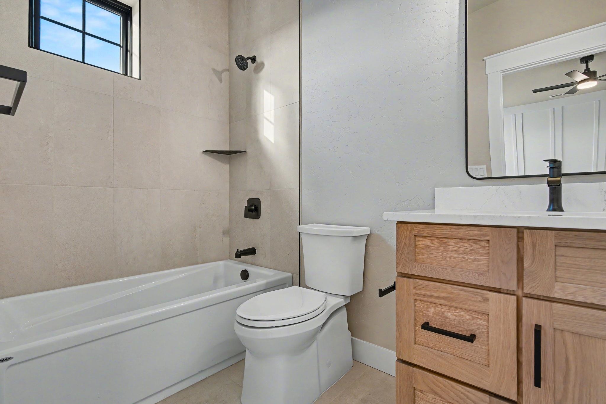 1924 K Road Fruita, CO 81521 - Photo 28 of 40 a bathroom with a sink a toilet and shower