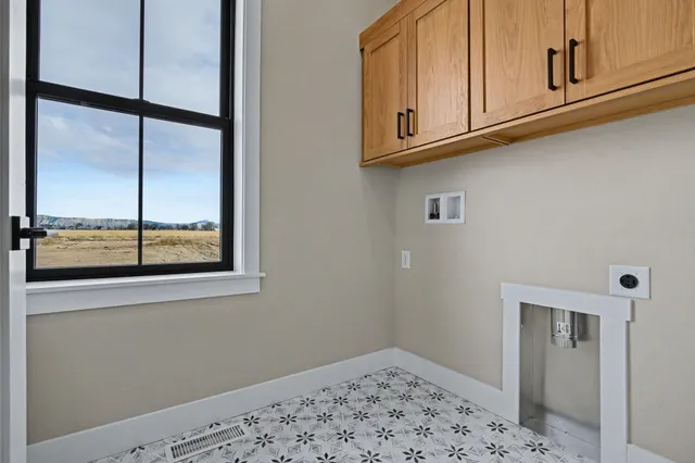 a view of a closet area with wooden floor