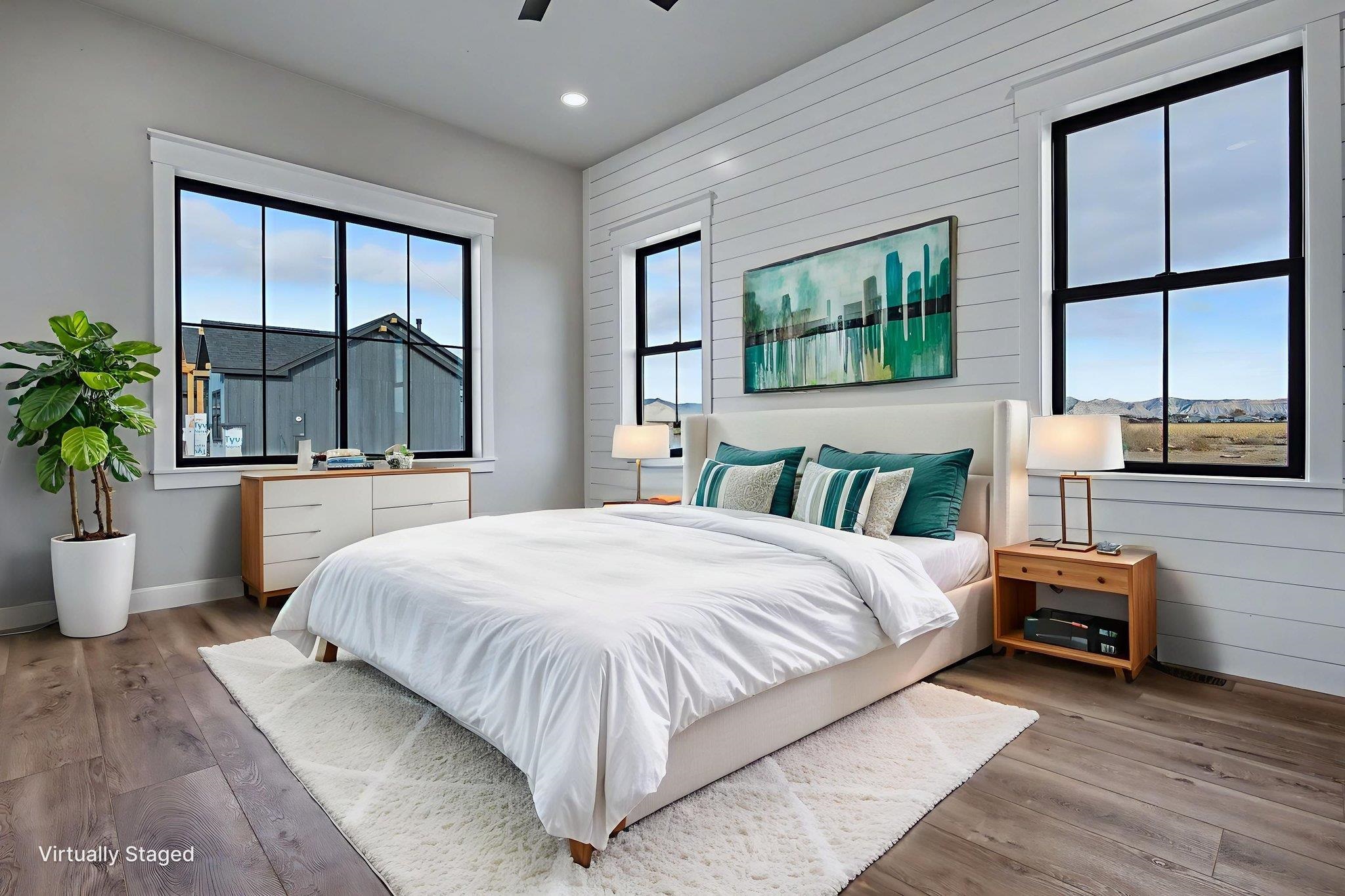 1924 K Road Fruita, CO 81521 - Photo 36 of 40 a bedroom with a large bed and a large window