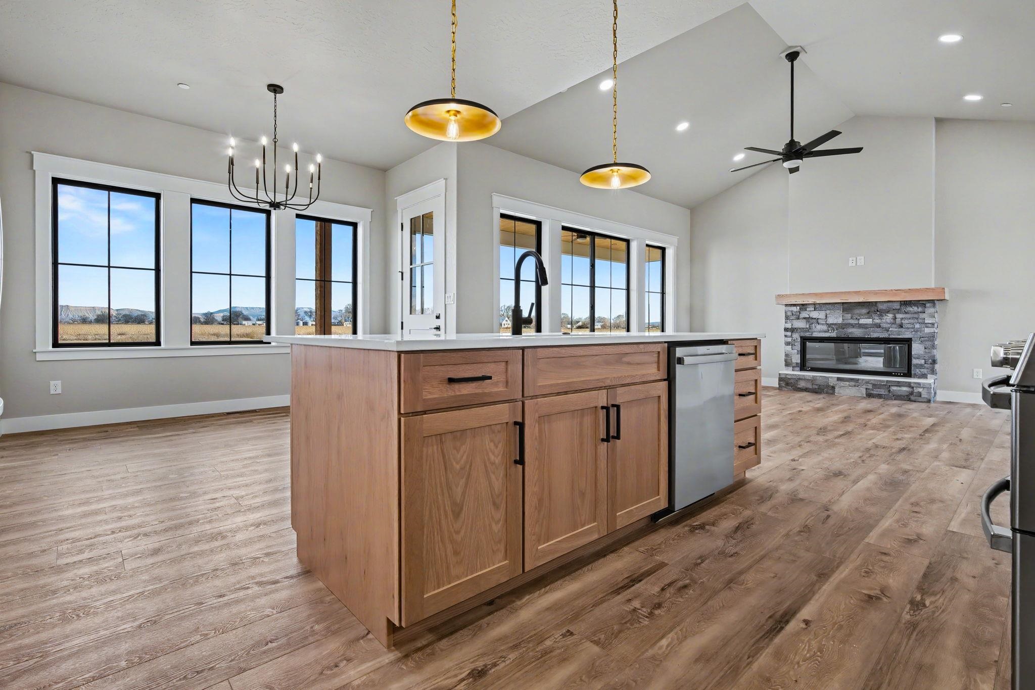 1924 K Road Fruita, CO 81521 - Photo 8 of 40 a kitchen that has a lot of cabinets and wooden floor