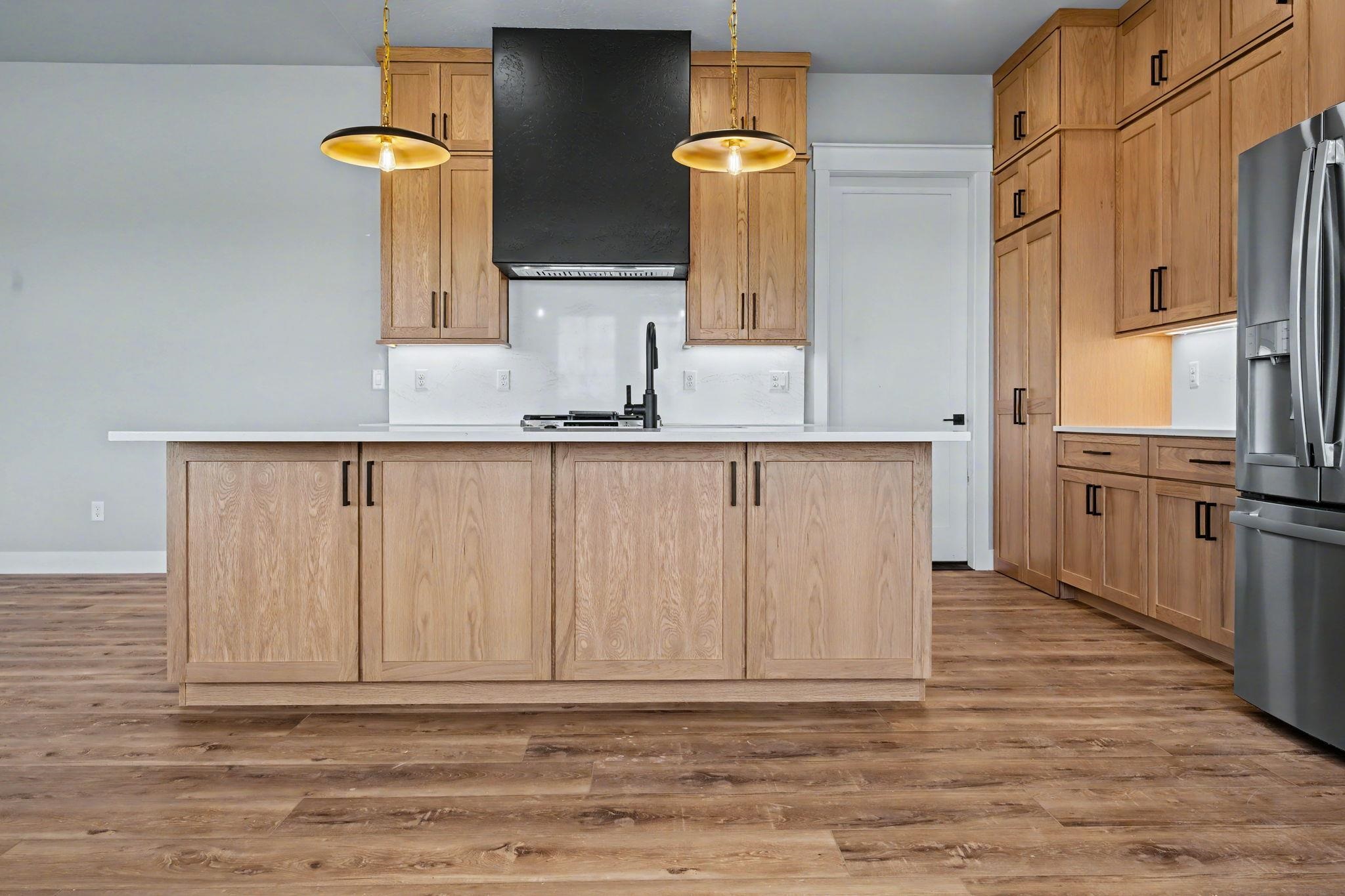 1924 K Road Fruita, CO 81521 - Photo 9 of 40 a view of a kitchen with wooden floor