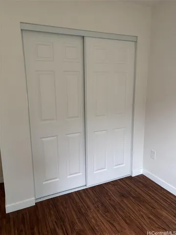 a view of room with hardwood floor