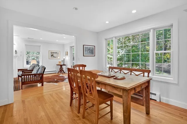 a view of a city with lush green forest