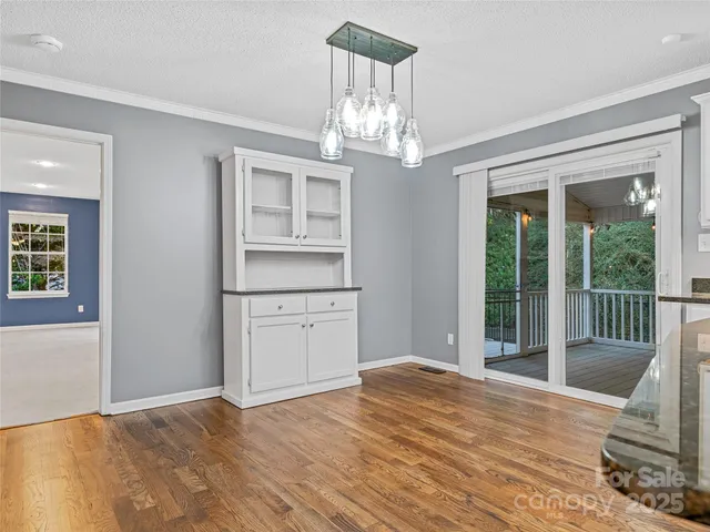a view of a livingroom with wooden floor