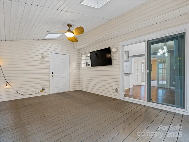 a view of a balcony with wooden floor