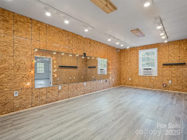 an aerial view of residential house with outdoor space and swimming pool