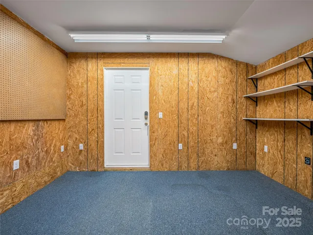 a front view of a house with a bench