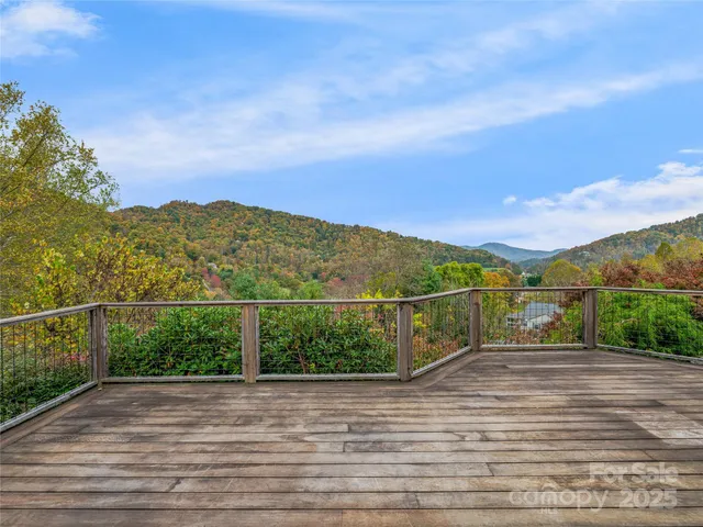 a view of a livingroom with an empty space and a fireplace