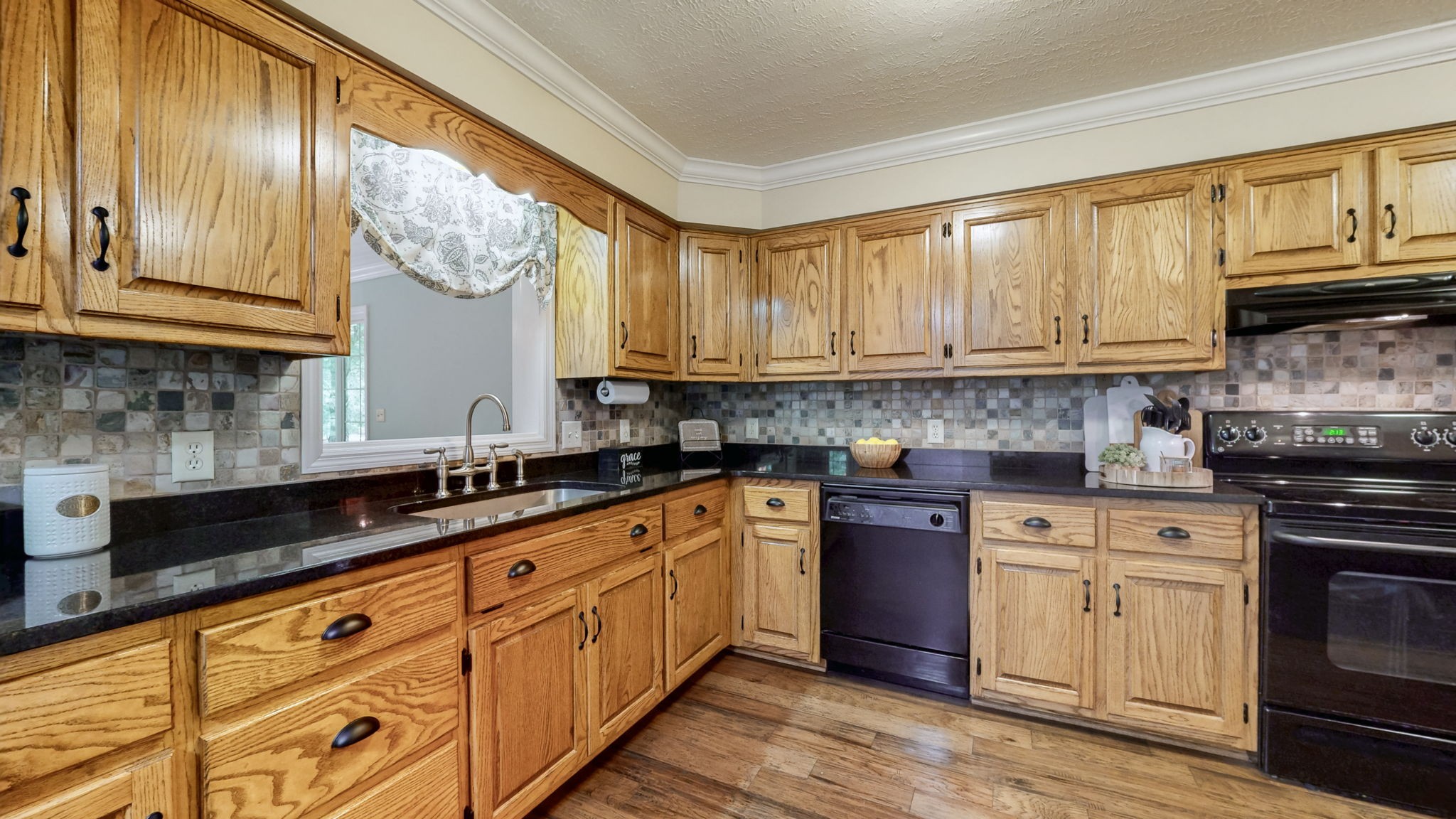 830 Motlow College Road Normandy, TN 37360 - Photo 31 of 70 a kitchen with granite countertop wooden cabinets and a stainless steel appliances