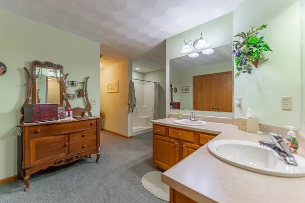 a bathroom with a tub sink and a mirror
