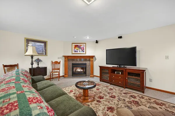 a view of a livingroom with furniture and a flat screen tv