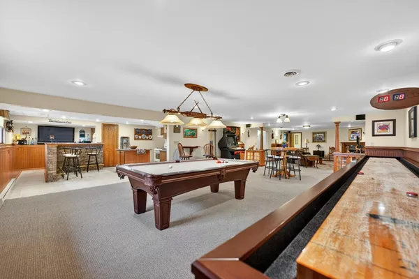 a kitchen with a table and chairs in it