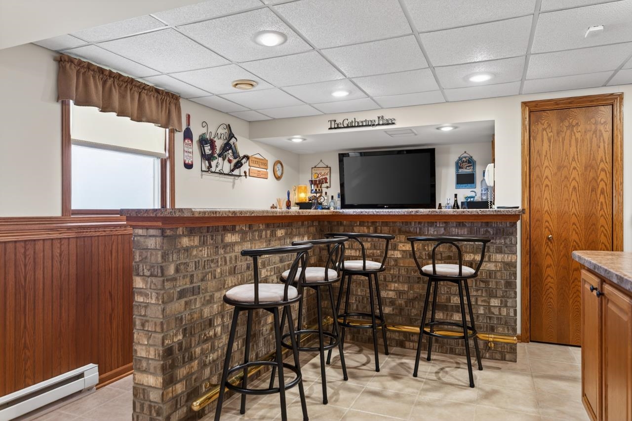 10023 Auburn Road Winnebago, IL 61088 - Photo 23 of 59 a kitchen with a table and chairs in it