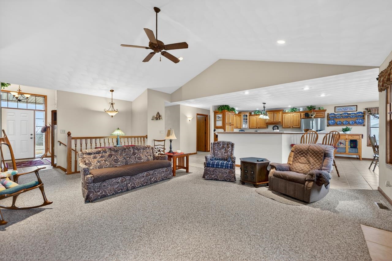 10023 Auburn Road Winnebago, IL 61088 - Photo 59 of 59 a living room with furniture and a ceiling fan