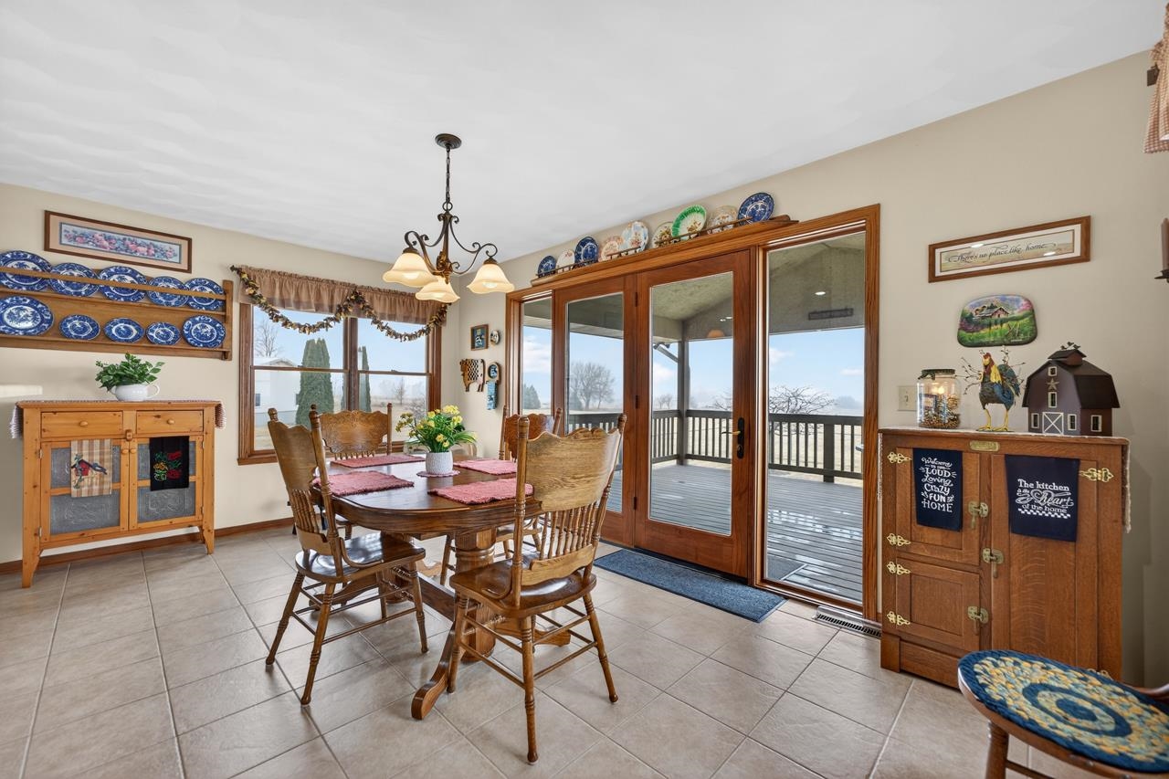 10023 Auburn Road Winnebago, IL 61088 - Photo 6 of 59 a view of a dining room with furniture window and outside view