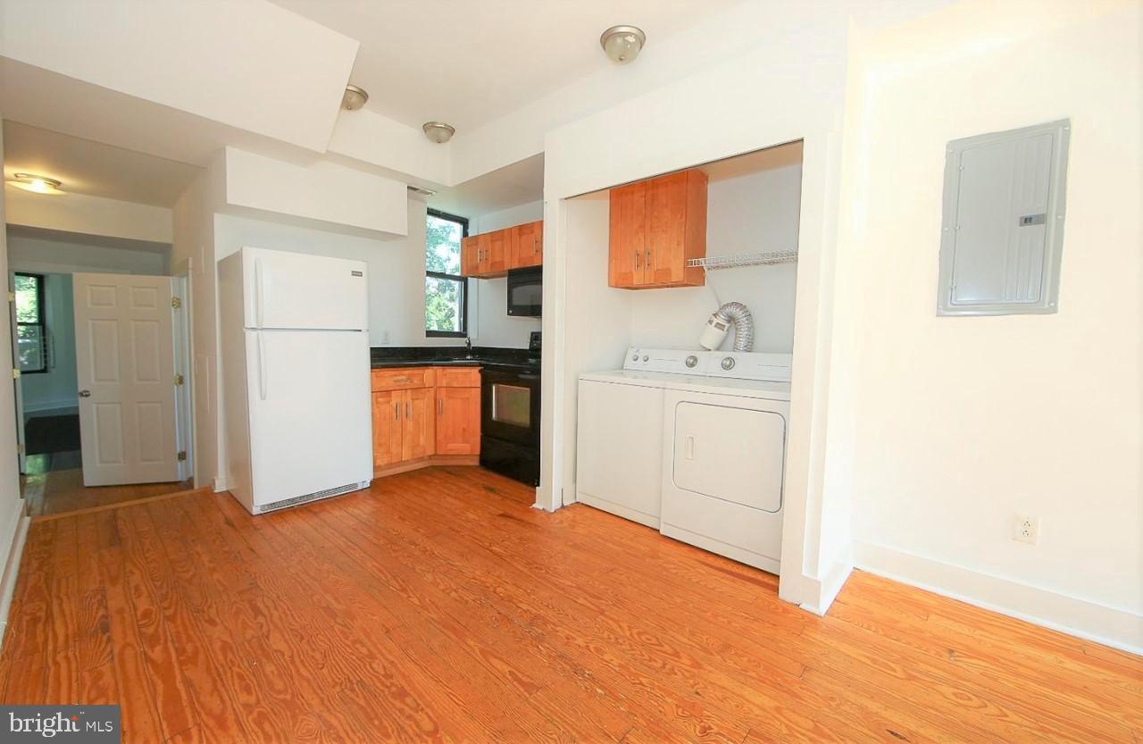 2018 North 18th Street, Unit B Philadelphia, PA 19121 - Photo 1 of 16 a view of a kitchen with a sink and a refrigerator
