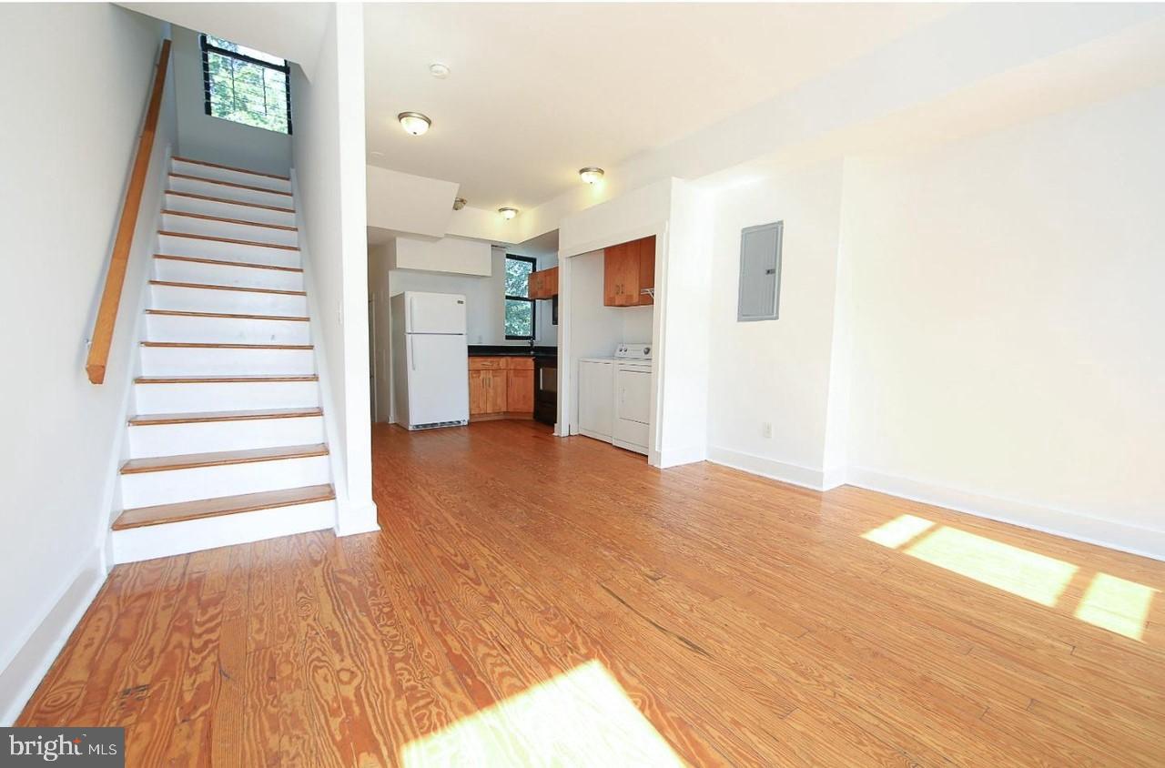 2018 North 18th Street, Unit B Philadelphia, PA 19121 - Photo 3 of 16 a view of a kitchen with wooden floor and a window
