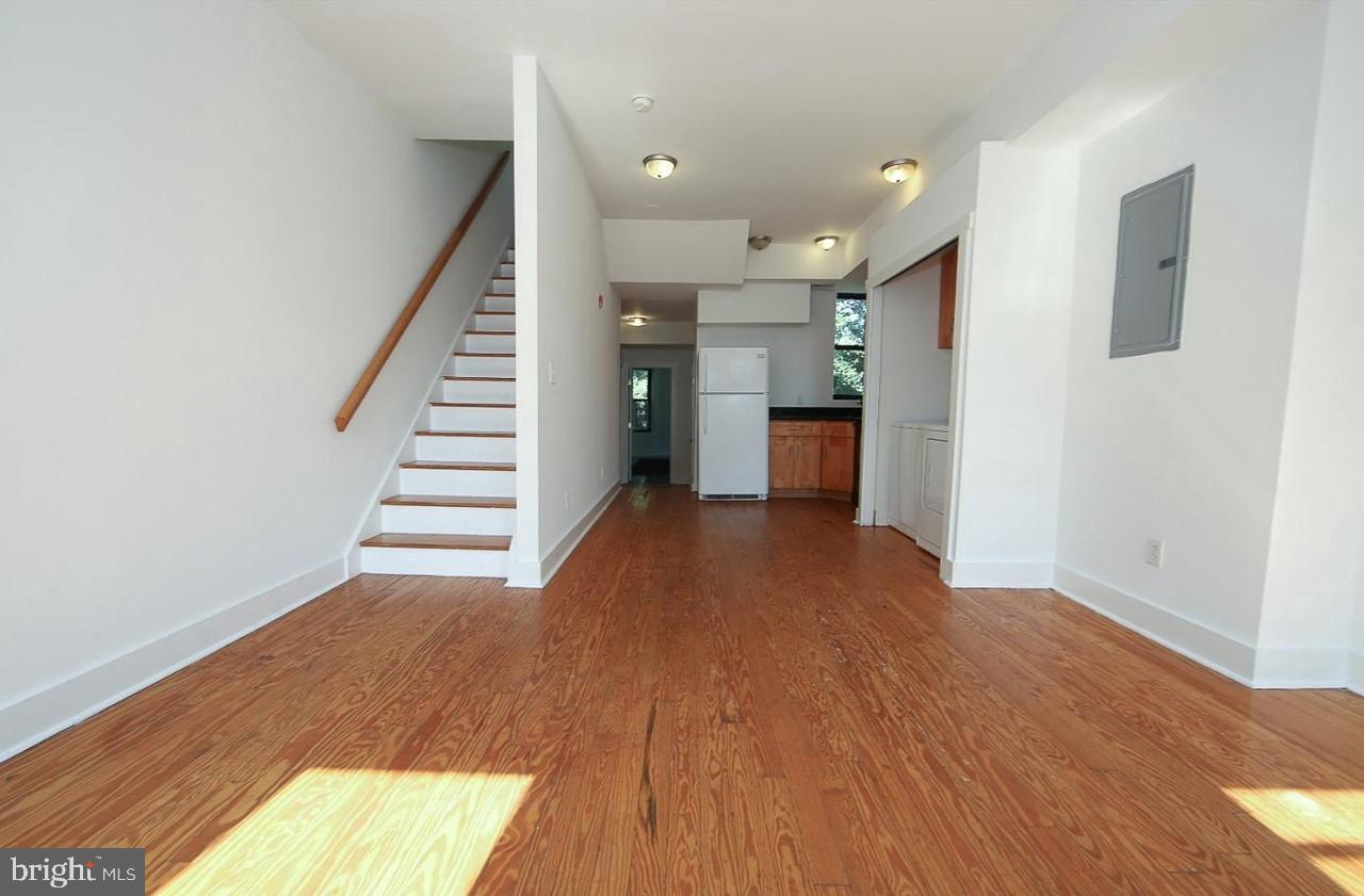 2018 North 18th Street, Unit B Philadelphia, PA 19121 - Photo 4 of 16 a view of a room with wooden floor and stairs