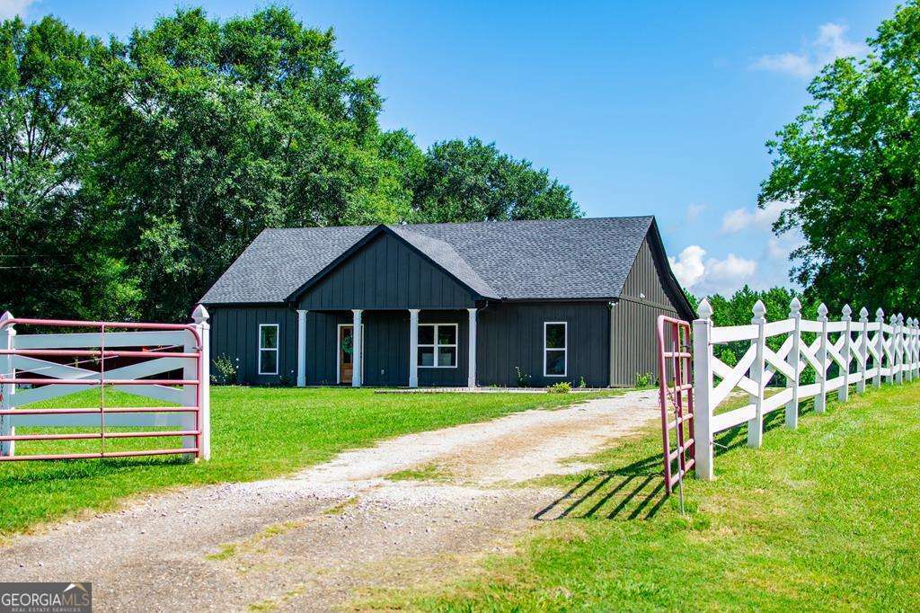 20735 Main Street Ranburne, AL 36273 - Photo 1 of 1 a view of a house with a yard and fence