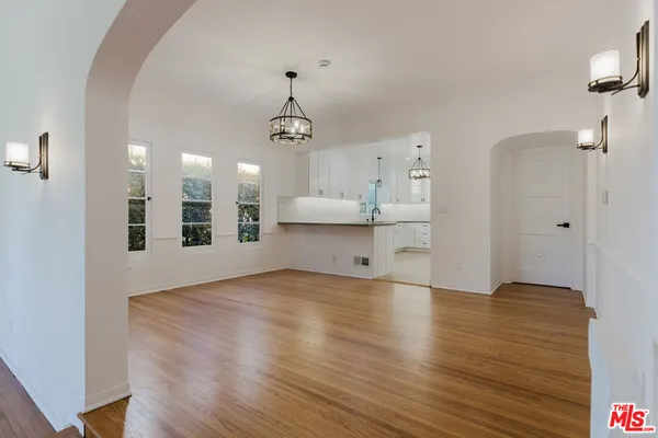 a view of a kitchen with a sink and a kitchen counter top space