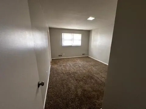 an empty room with a fireplace