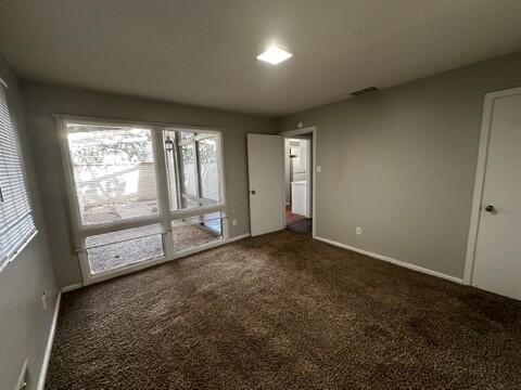 2003 32nd Street, Unit A Lubbock, TX 79411 - Photo 21 of 22 an empty room with large windows