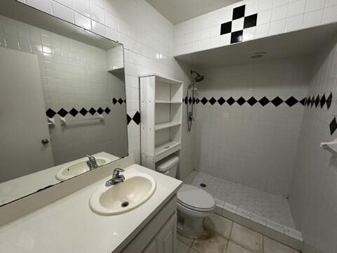 2003 32nd Street, Unit A Lubbock, TX 79411 - Photo 22 of 22 a bathroom with a sink toilet and shower