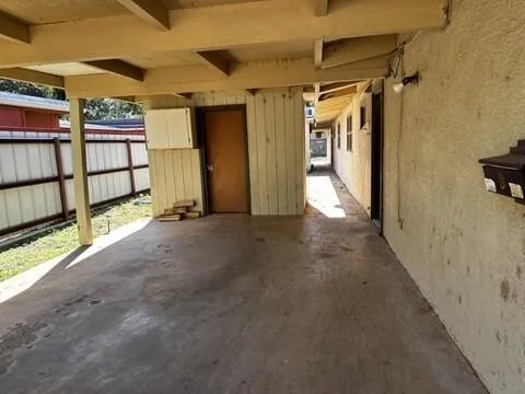 a view of a hallway with stairs