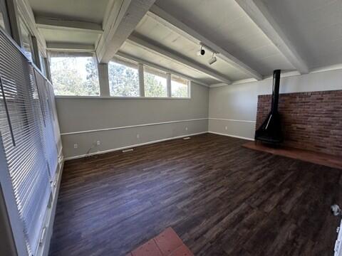 2003 32nd Street, Unit A Lubbock, TX 79411 - Photo 8 of 22 a view of an empty room with wooden floor and a window