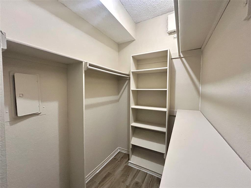 3609 West Northgate Drive, Unit 116 Irving, TX 75062 - Photo 6 of 8 a view of walk in closet with empty racks